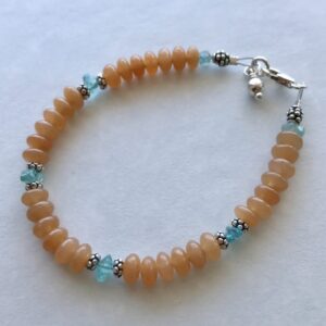 Peace Within Adorable Amazonite Bracelet Happy bracelets make for happy life! Blue amazonite stones with a pretty glass flower. Handcrafted by Anna Kerr.